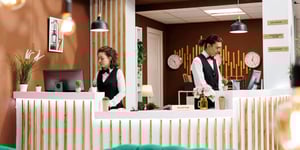 Hotel staff using connected systems at front desk