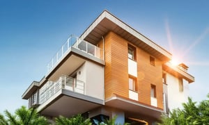 Modern smart building with balconies and contemporary design under blue sky.